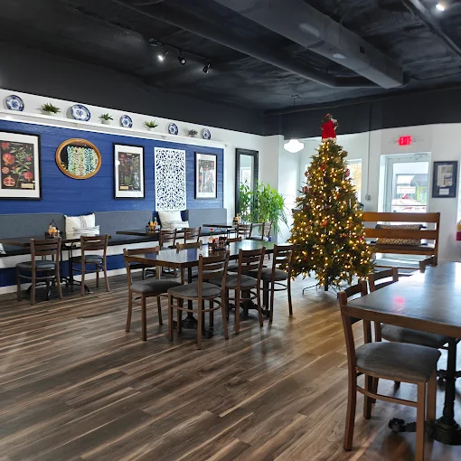 Momma D welcoming guests in her warm Southern kitchen — placeholder interior photo