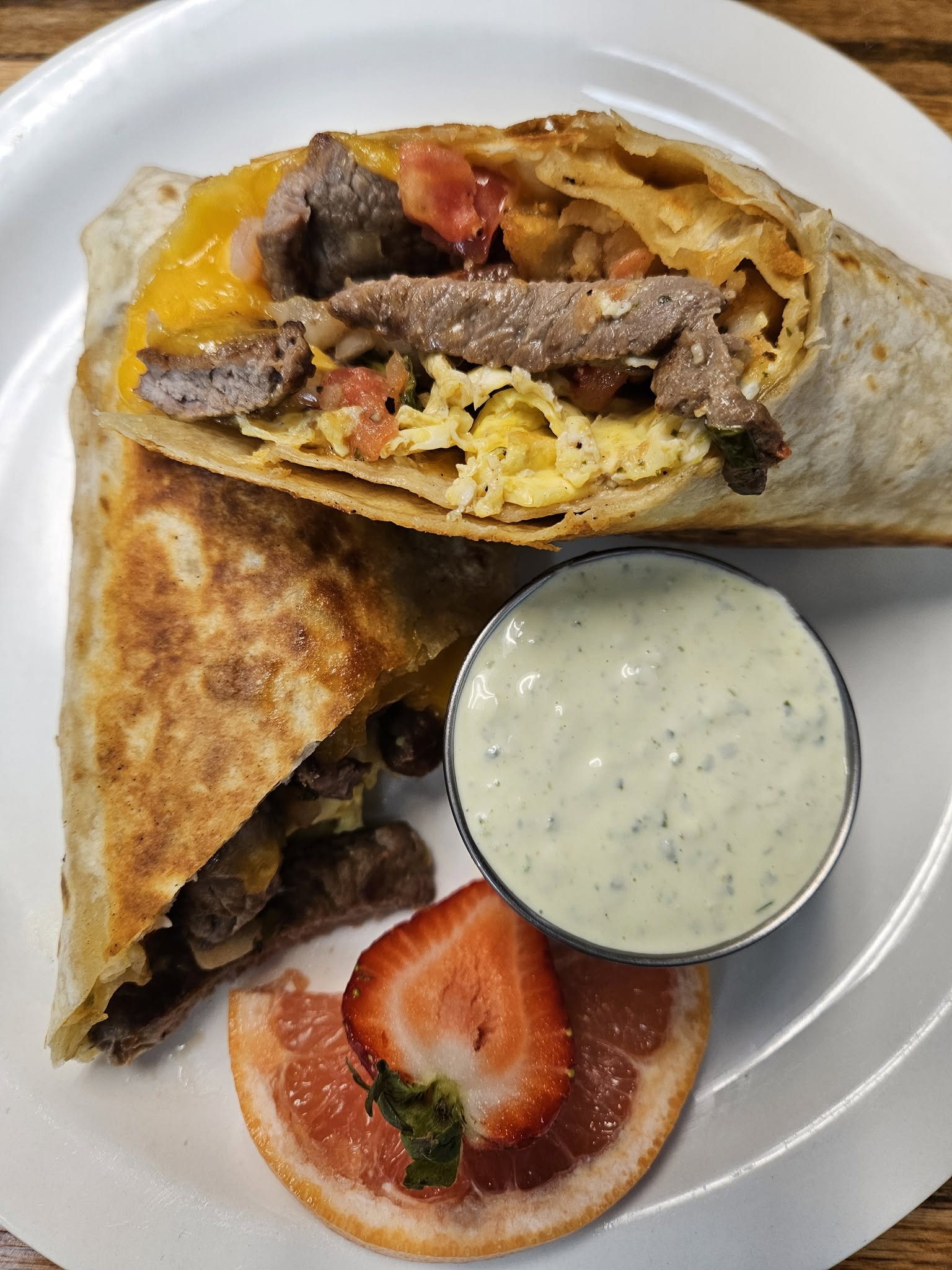 A delicious-looking stuffed breakfast burrito from Momma D's